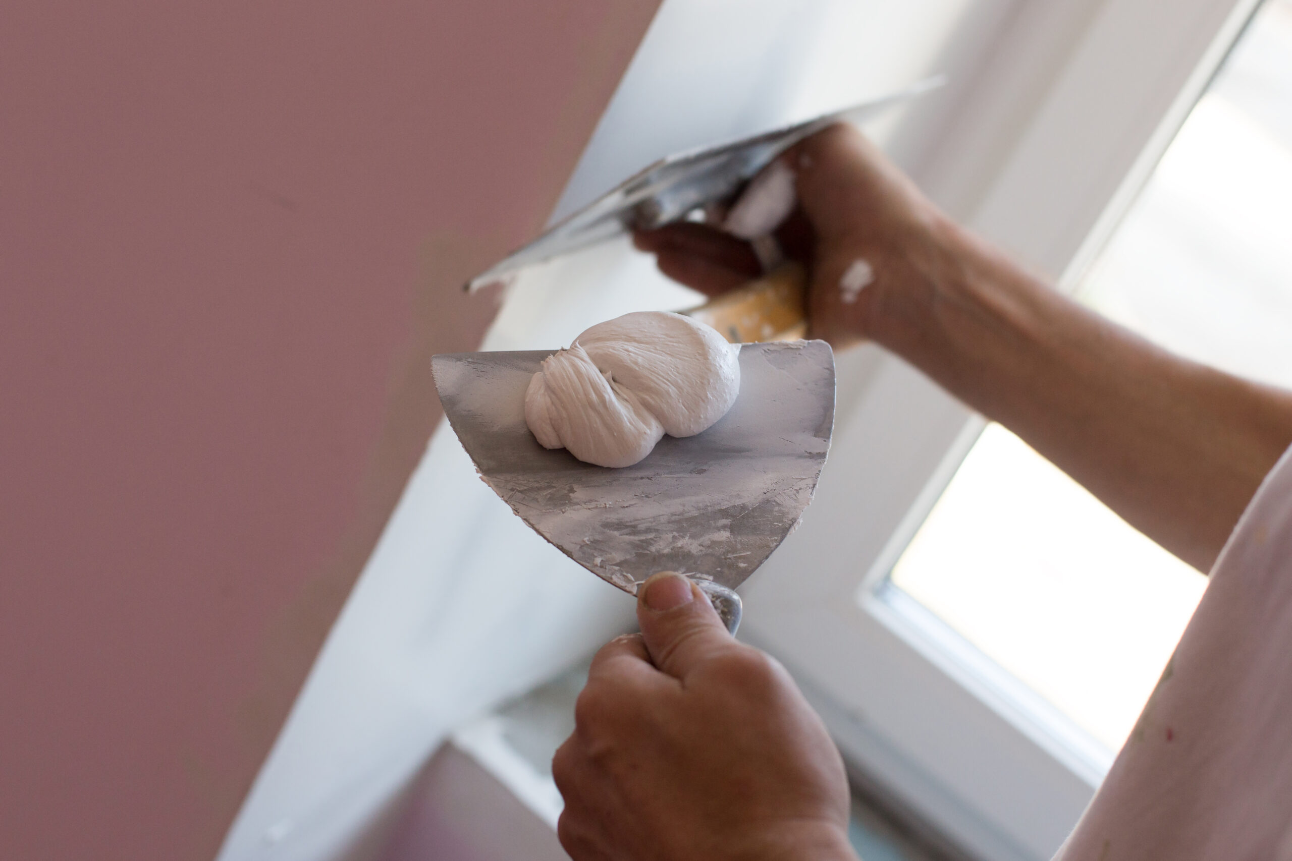 House painter skimming wall
